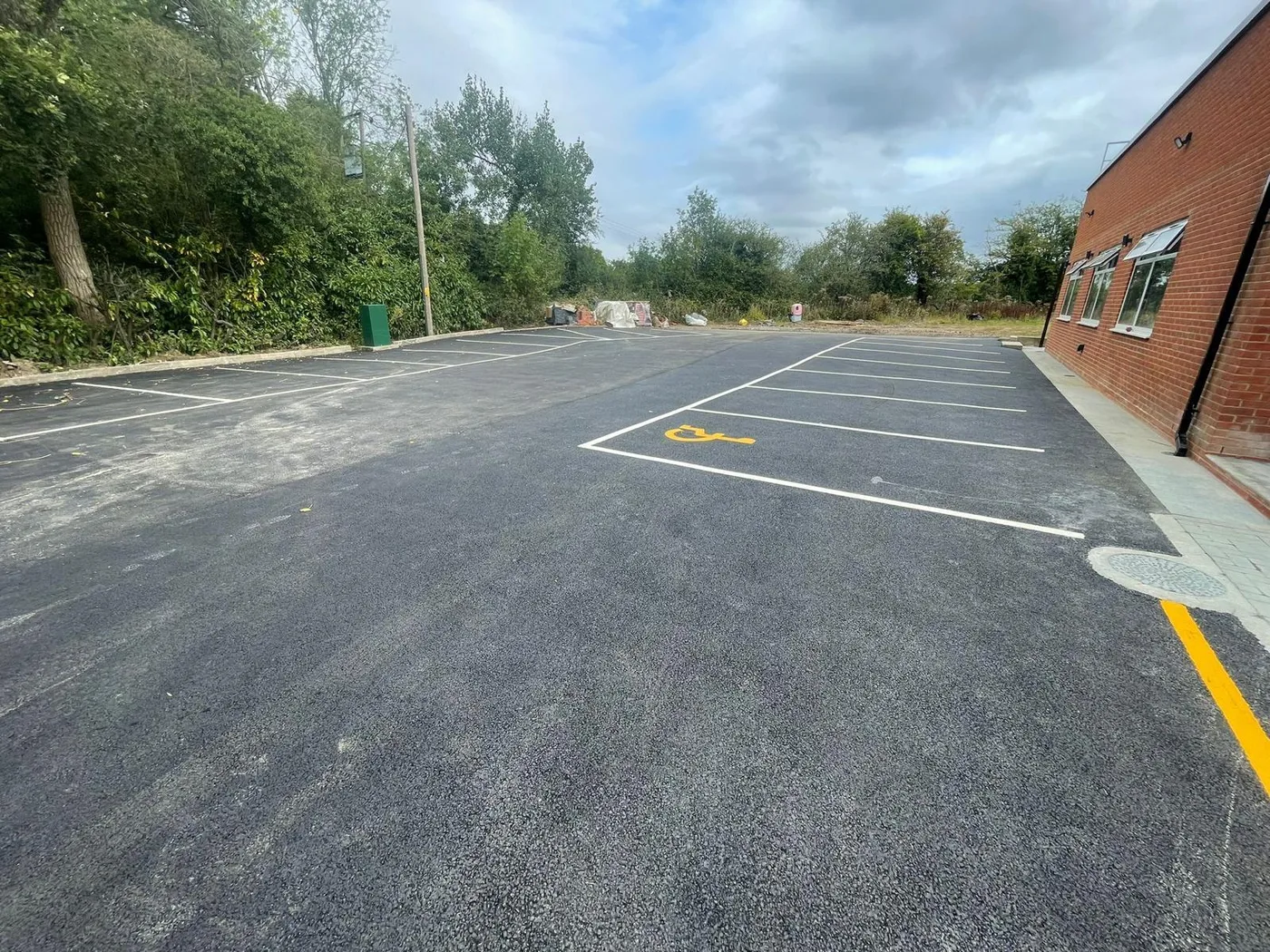 A large car park after resurfacing and line marking