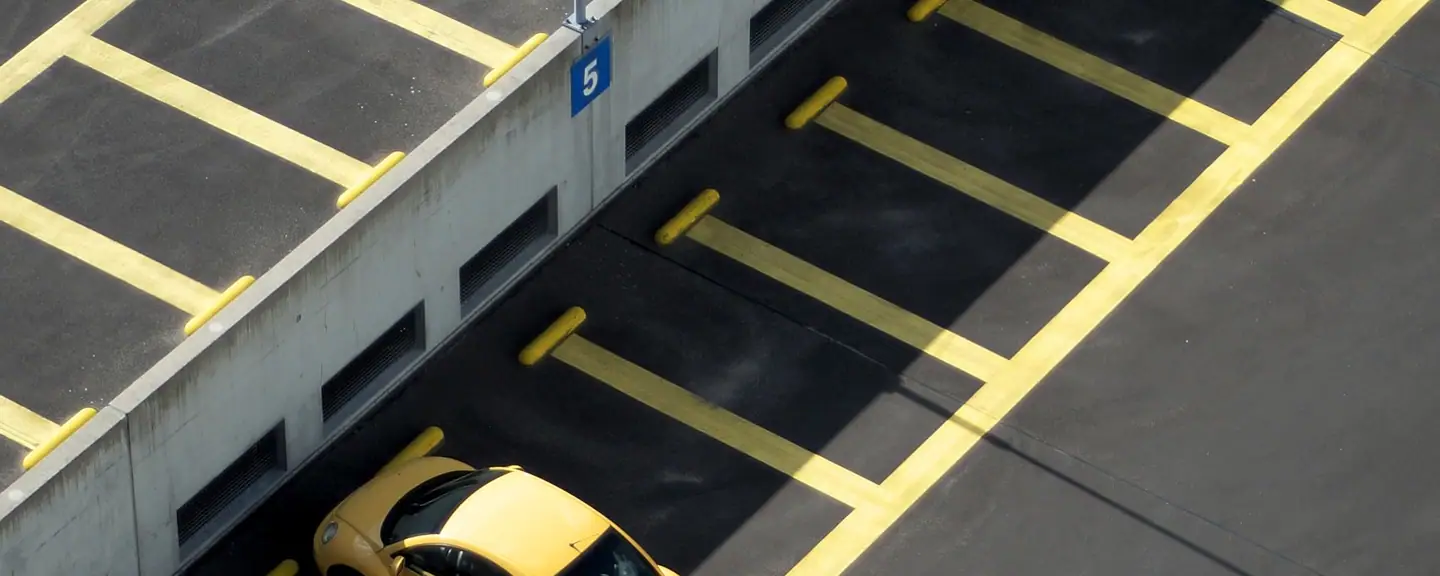 Yellow markings on a multi-storey parking deck — Car Park Resurfacing in Hackney by Meads Resurfacing