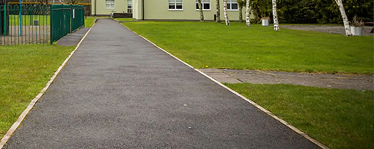 A resurfaced path running between buildings — Path Resurfacing in Bexley by Meads Resurfacing