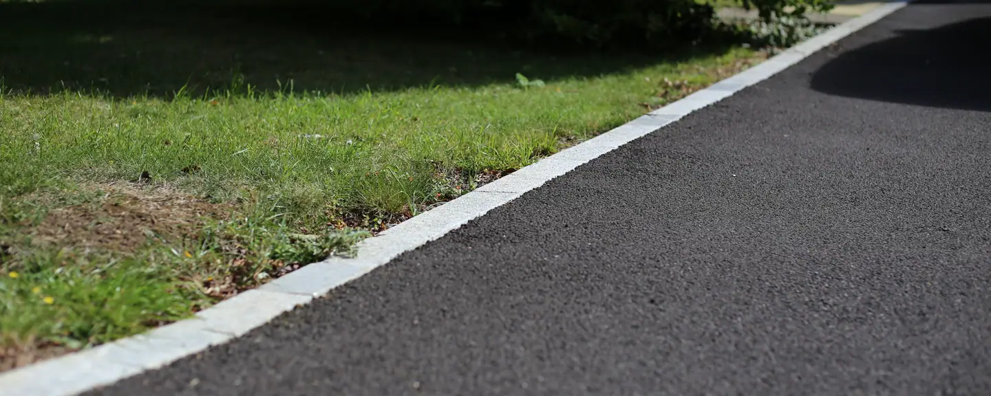 A tarmac path edge detail at the verge — Path Resurfacing in Chiswick by Meads Resurfacing