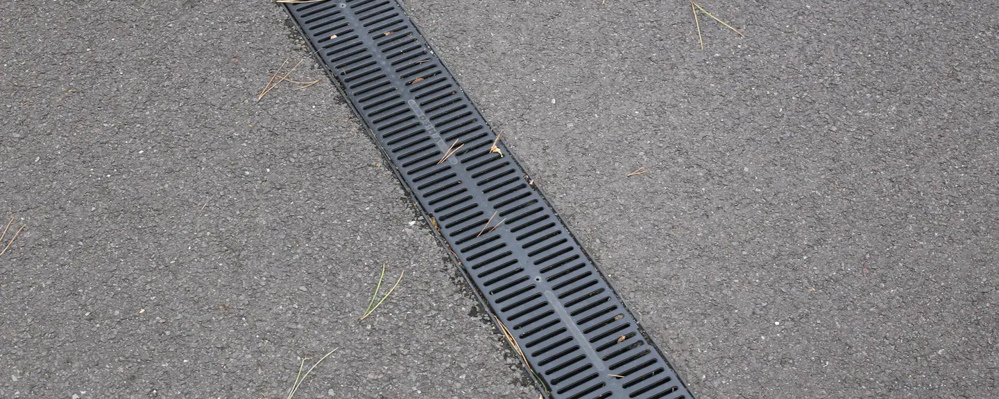 A channel drain along a resurfaced path — Path Resurfacing in Brompton by Meads Resurfacing