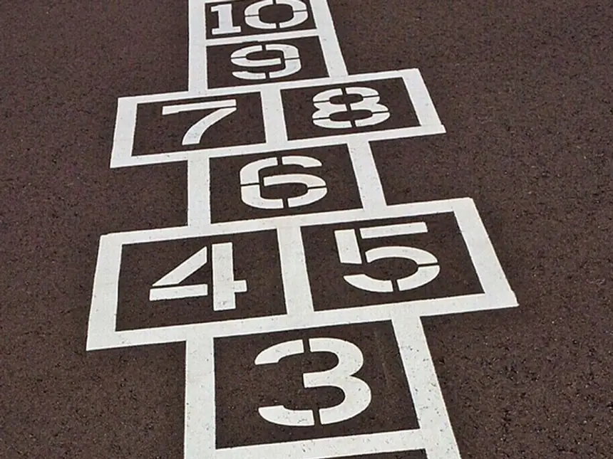 A resurfaced school play area with games markings