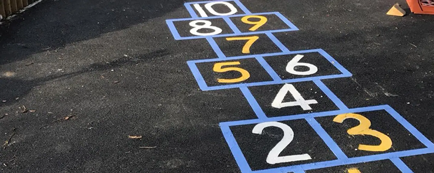 Coloured playground markings on new tarmac — Playground Resurfacing in Dover by Meads Resurfacing