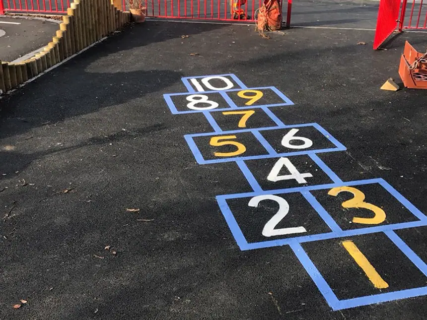Coloured playground markings on new tarmac