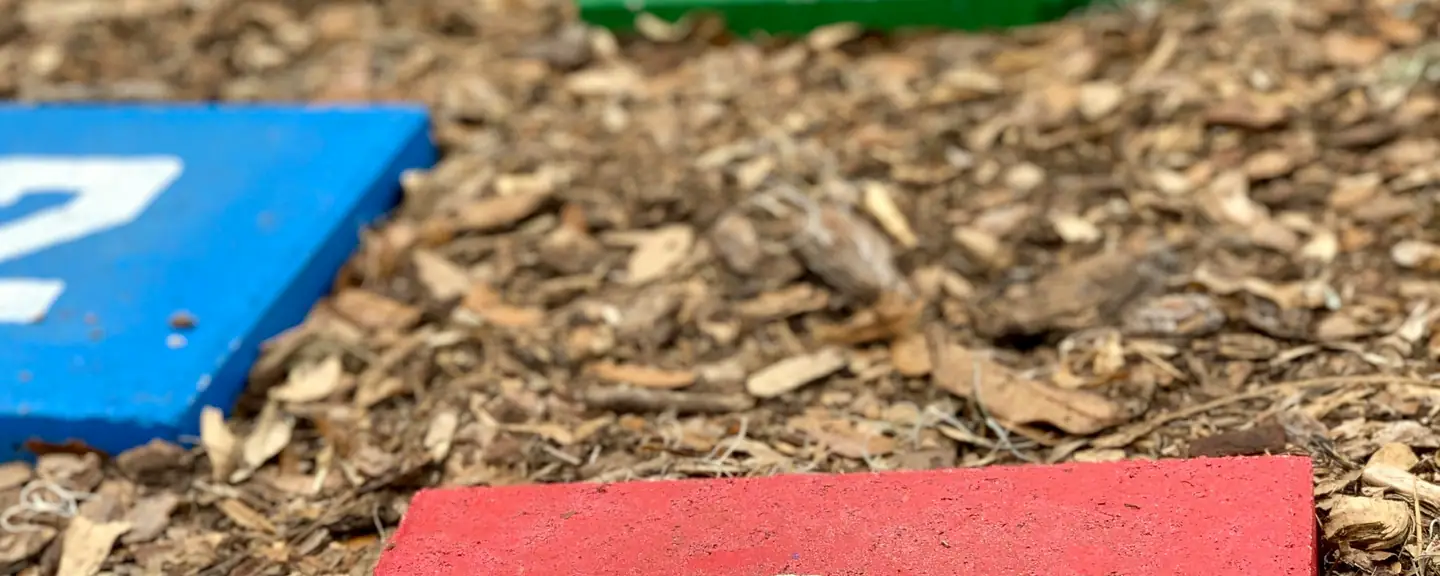 Numbered play markings on a soft play surface — Playground Resurfacing in Barking by Meads Resurfacing