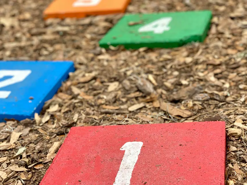 Numbered play markings on a soft play surface