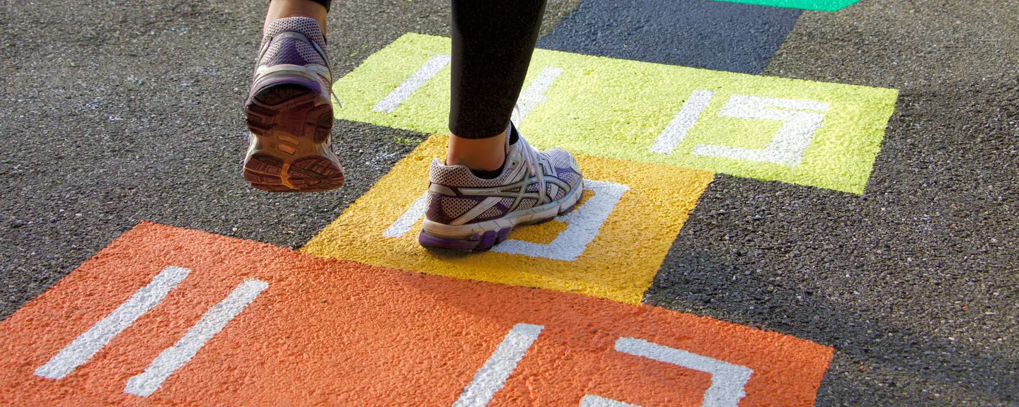 Hopscotch markings painted on a play surface — Playground Resurfacing in Epsom by Meads Resurfacing