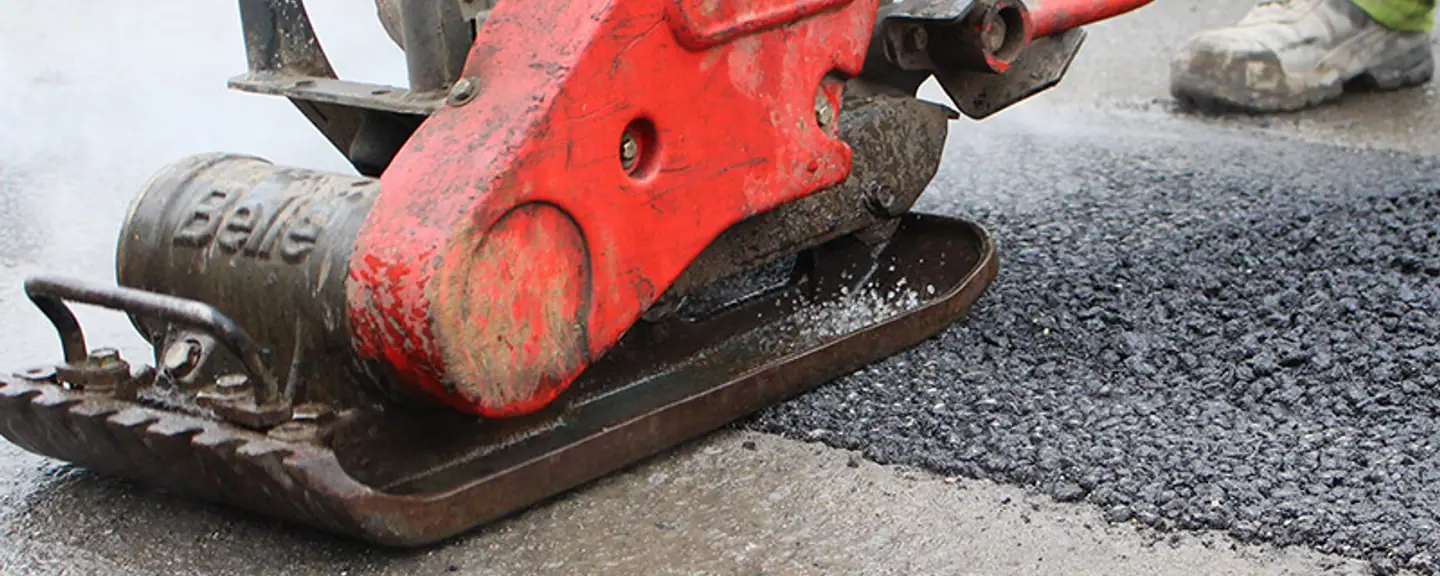 A completed asphalt patch over a filled pothole — Pothole Repairs in Whyteleaf by Meads Resurfacing