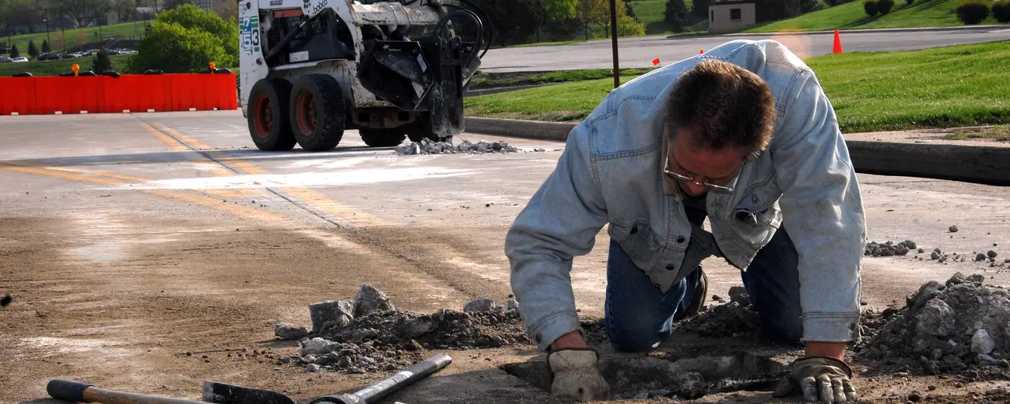A pothole repair under way in a road — Pothole Repairs in Tonbridge by Meads Resurfacing