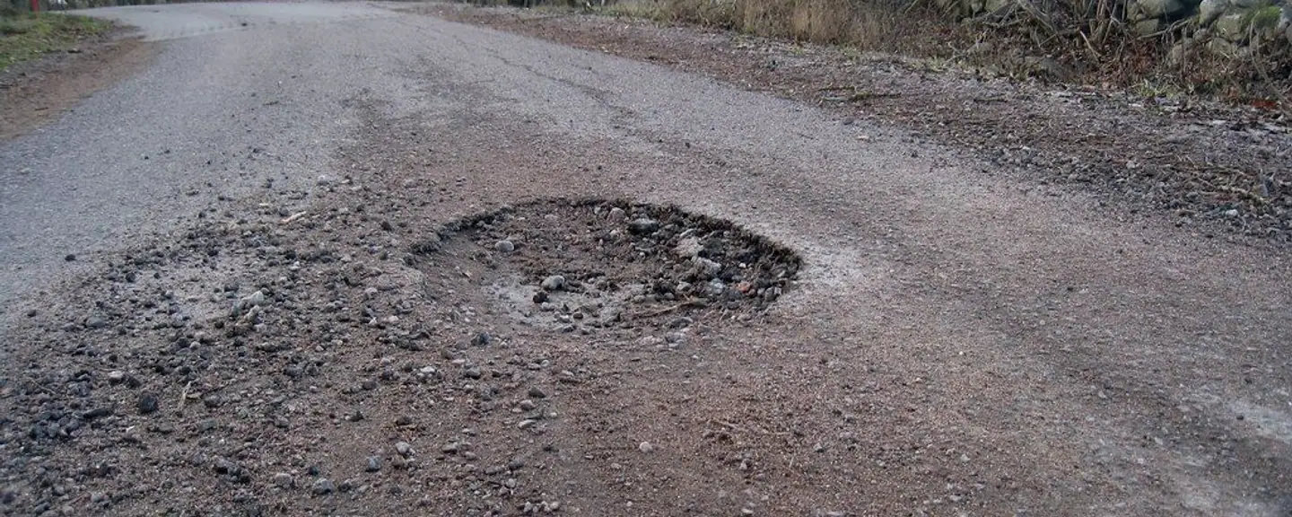 A repaired pothole blended into the road — Pothole Repairs in Barking by Meads Resurfacing