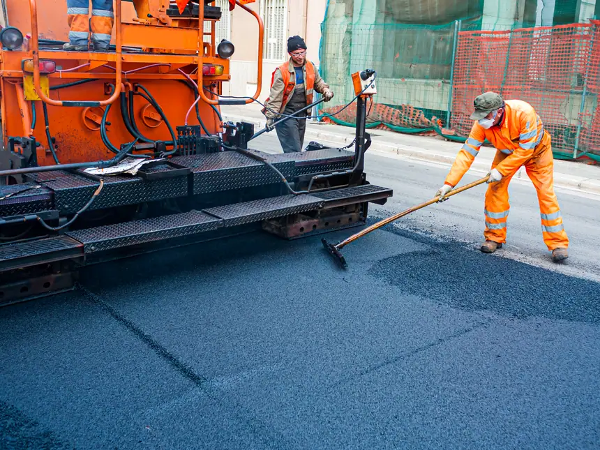 A paving machine feeding a new surface course