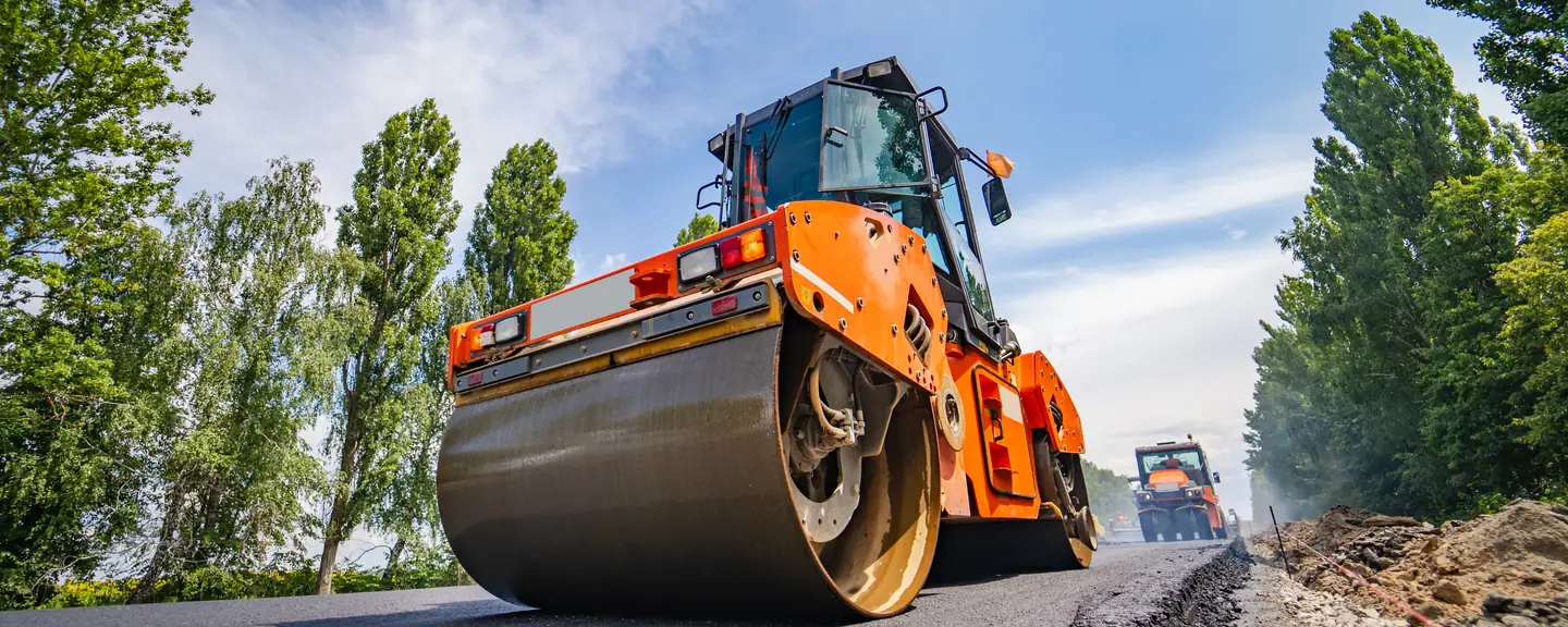 Two rollers compacting a newly surfaced road — Road Resurfacing in Sutton by Meads Resurfacing