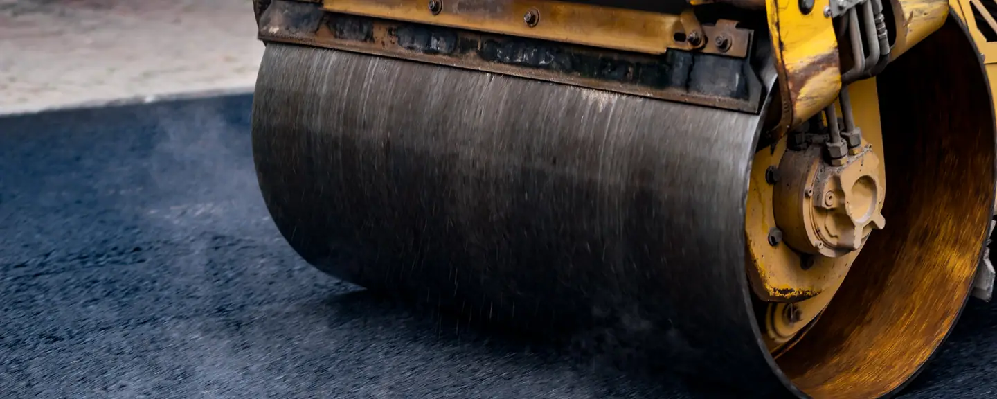 The drum of a road roller on new asphalt — Road Resurfacing in Cobham by Meads Resurfacing