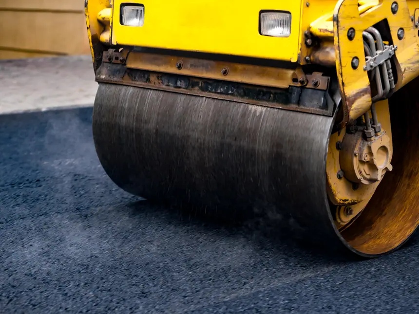The drum of a road roller on new asphalt