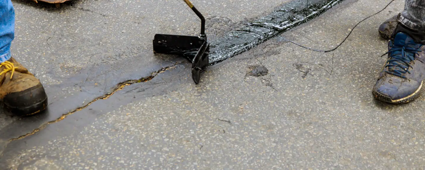 A worn surface being dressed over its cracking — Surface Dressing in Finchley by Meads Resurfacing