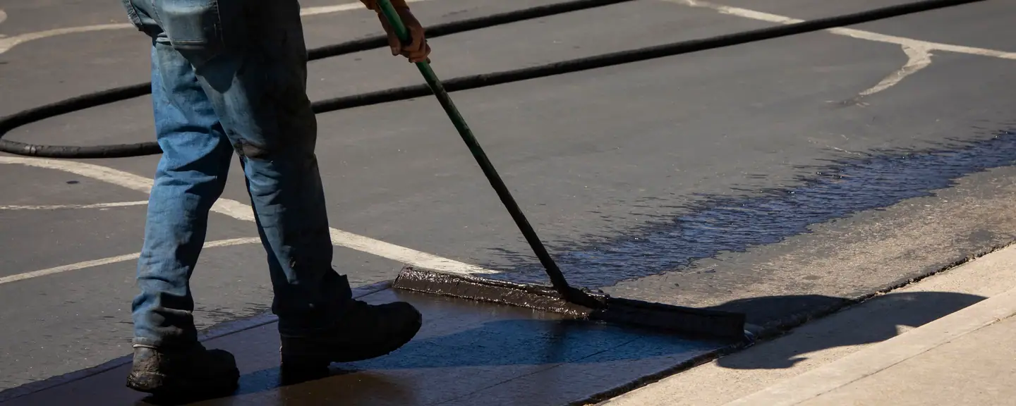 Sealant applied up to a painted line — Surface Dressing in Ashford, Middlesex by Meads Resurfacing