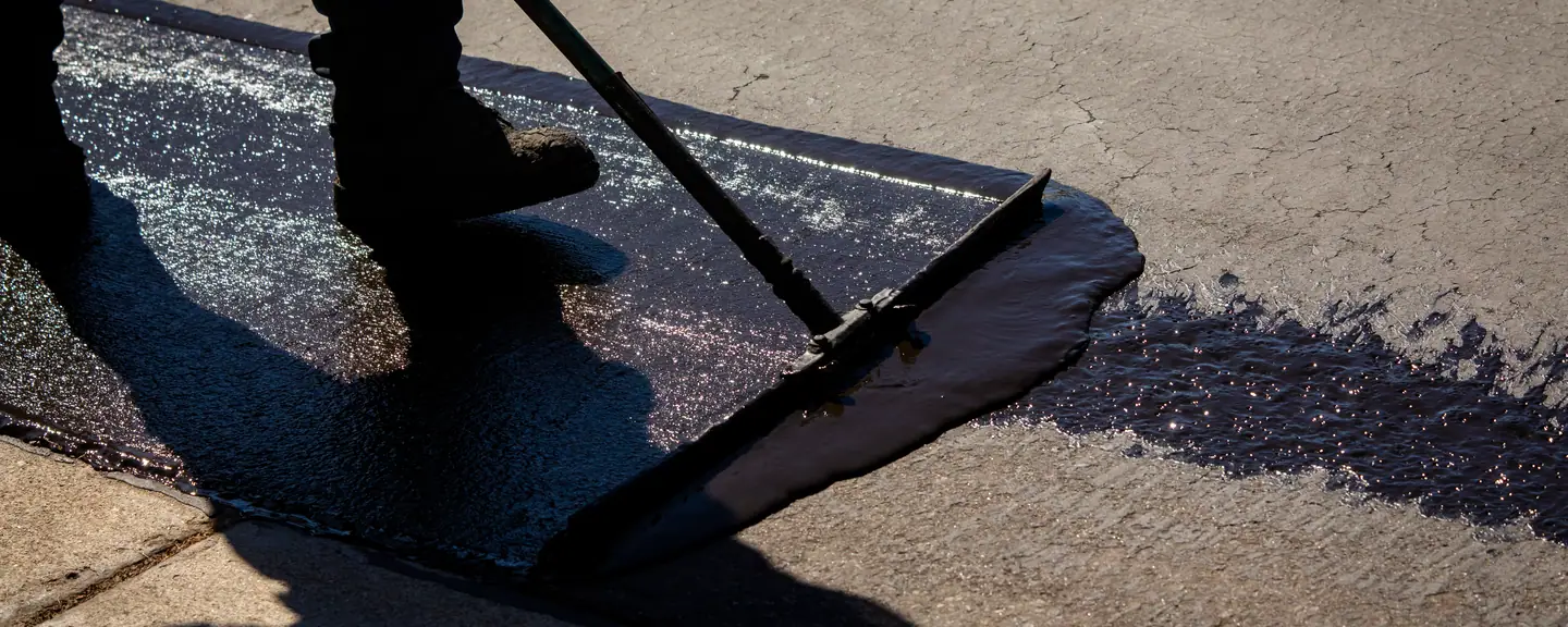 A sealed surface drying to an even dark finish — Surface Dressing in Borehamwood by Meads Resurfacing
