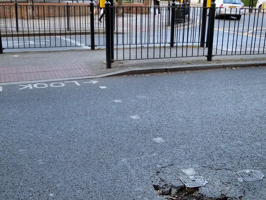 A pothole in a public road